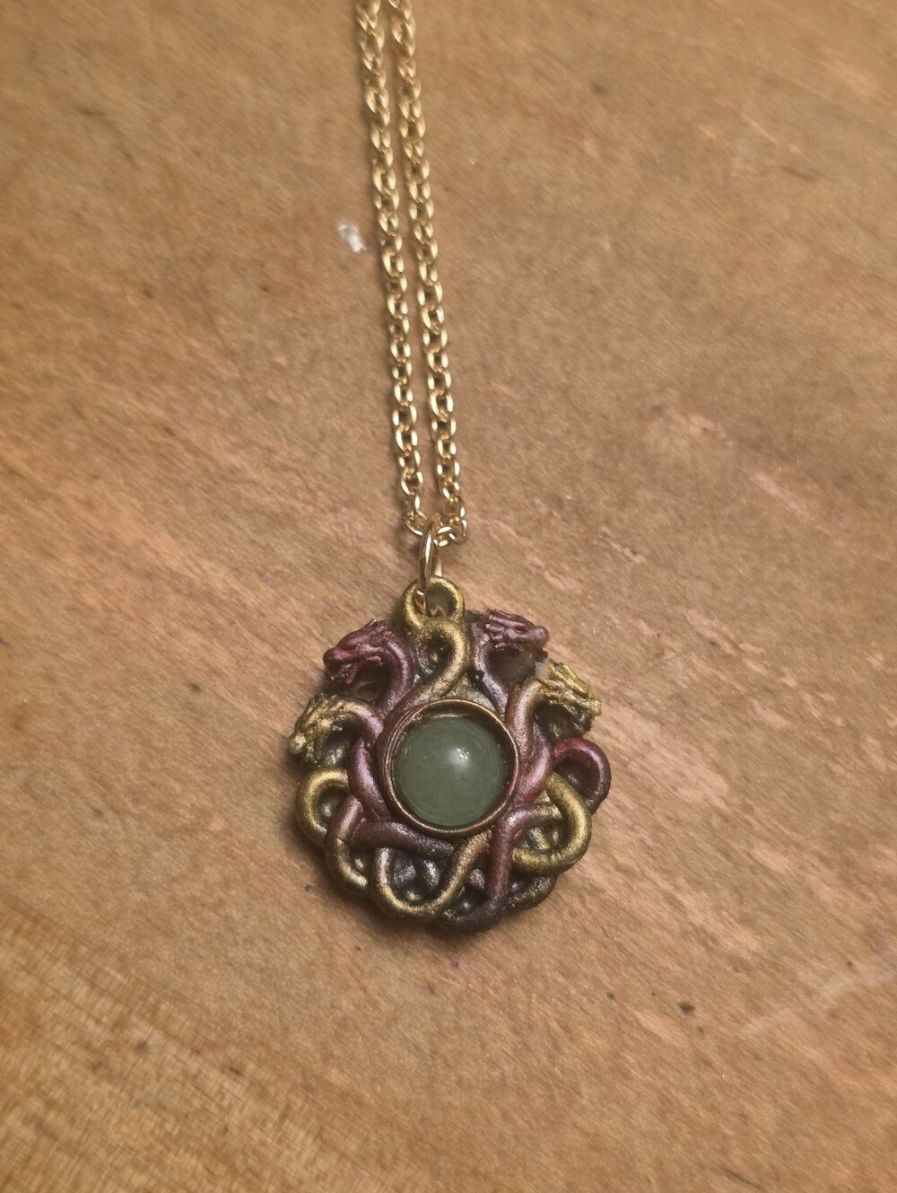 Ladies Resin Dragon Sphere Pendant W Central Green Stone On Gold Tone Chain
